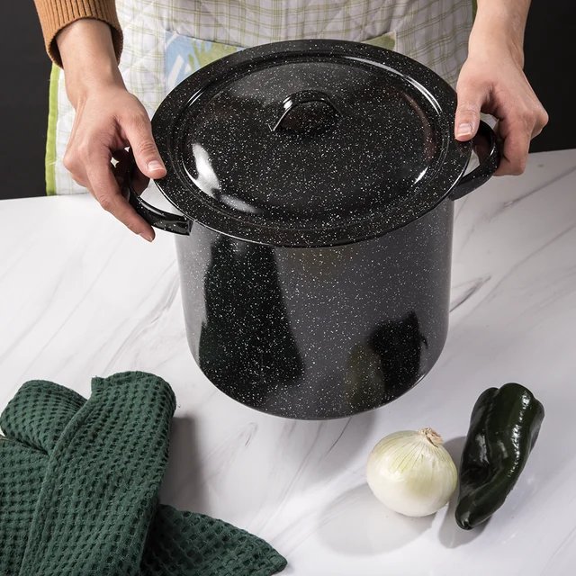 A covered black enamel pot in the kitchen